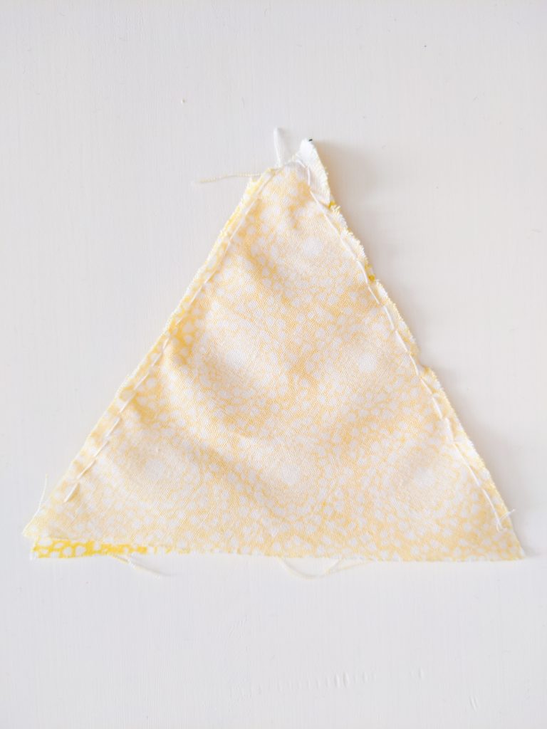 sew triangles together DIY birthday party bunting banner Montreal lifestyle fashion beauty blog