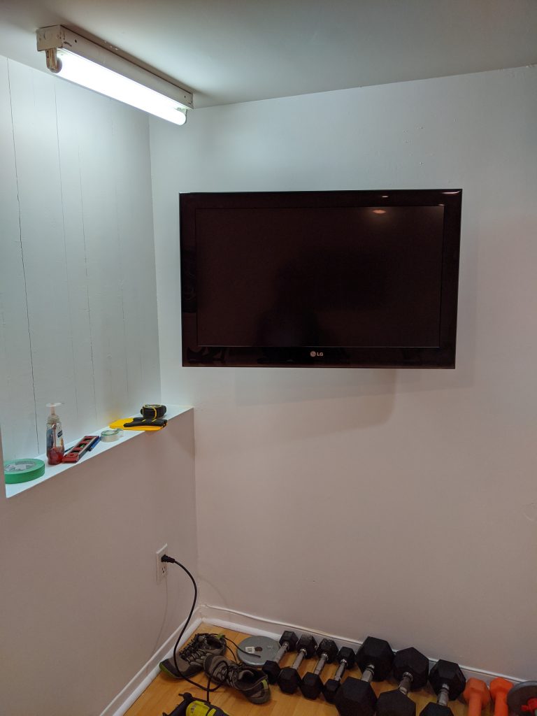 mount TV to wall DIY multi-purpose basement gym remodel Montreal lifestyle fashion beauty blog 2