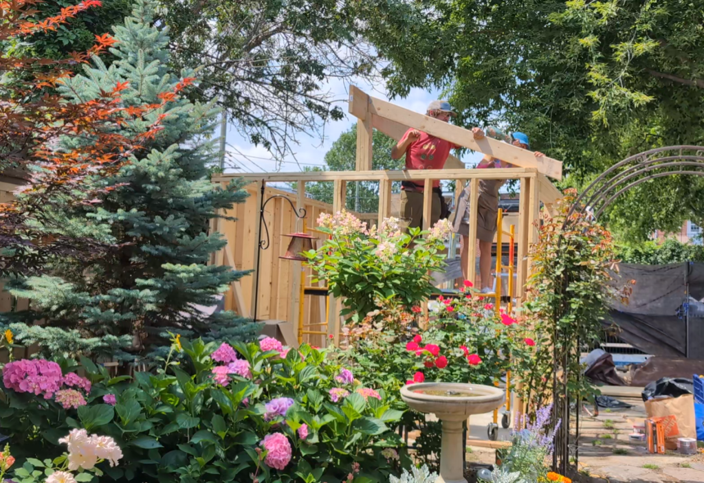 working on roof DIY shed remodel 2